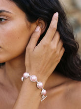 Pink Mabe Pearl bracelet shown worn on model with blush Pearls in polished sterling silver settings.
