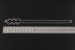 Amethyst sterling silver necklace shown beside a ruler for 18 inch length reference.