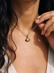 Citrine marquise pendant shown worn as a petite oxidized silver gemstone necklace.