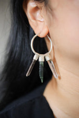 Earth Balance crystal stack hoop earring worn on a model, showing large silver hoop and gemstone movement.