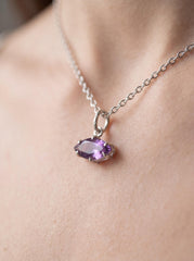 Amethyst marquise sterling silver pendant shown worn as a small violet gemstone necklace.