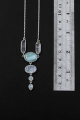 Ocean’s Whisper Radiance necklace shown beside a ruler for scale, with 6 cm pendant drop and sterling silver box chain.
