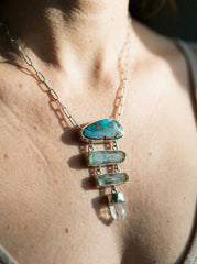 Australian Boulder Opal Aquamarine Lemurian Quartz pendant shown worn on a model, with sterling silver and moving crystal details.