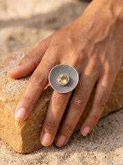 Solar Halo Citrine ring shown worn on hand with bold textured sterling silver disc face.