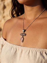 Ruby Rhodochrosite and Moonstone oxidized sterling silver pendant shown worn as a layered talisman necklace.