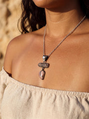 Ruby Rhodochrosite and Moonstone oxidized sterling silver pendant shown worn as a layered talisman necklace.