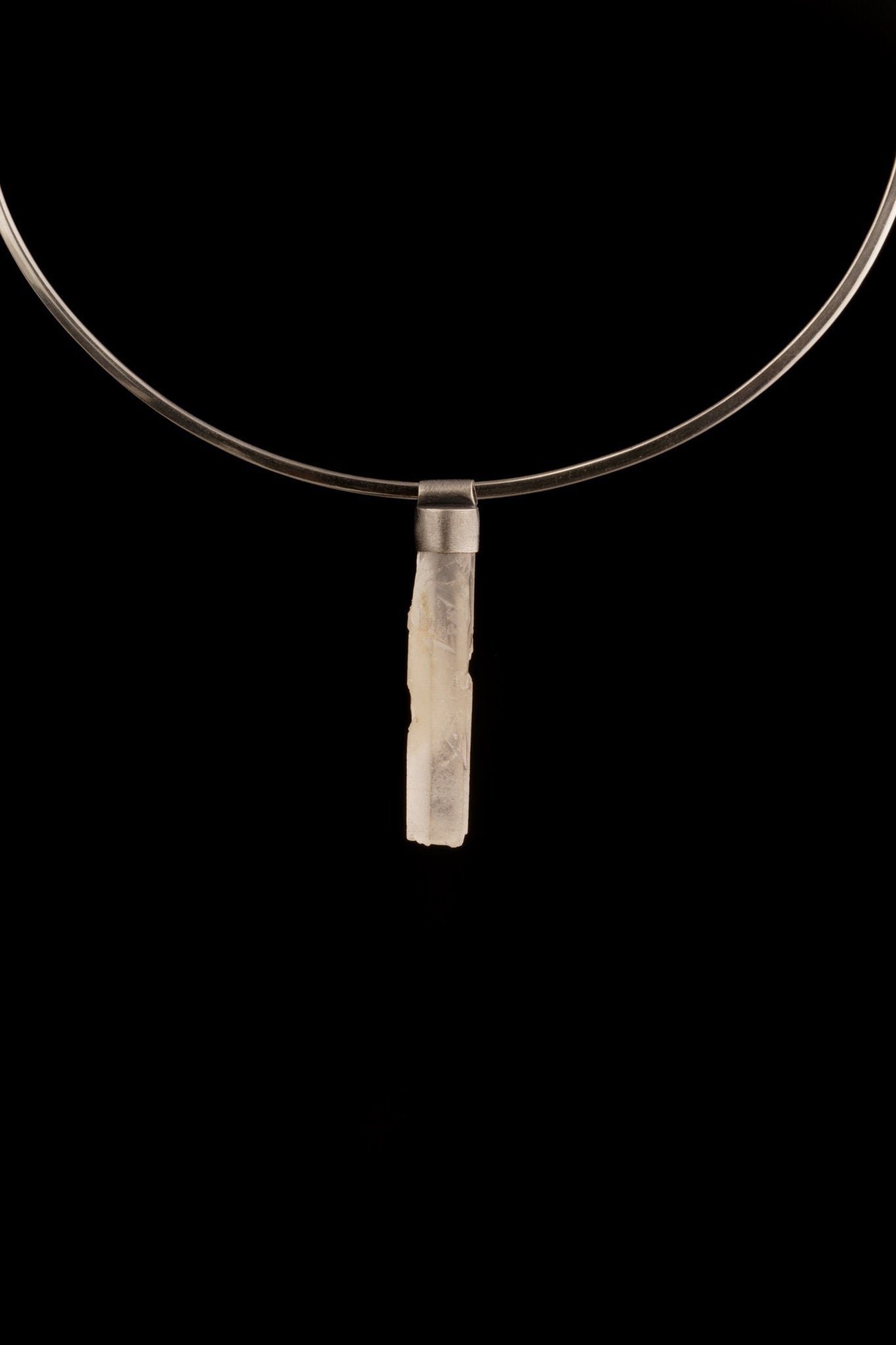 Rainbow Quartz Stack Pendant shown worn on black background with oxidized silver cap and compact crystal body.