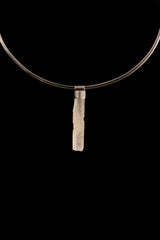 Rainbow Quartz Stack Pendant shown worn on black background with oxidized silver cap and compact crystal body.