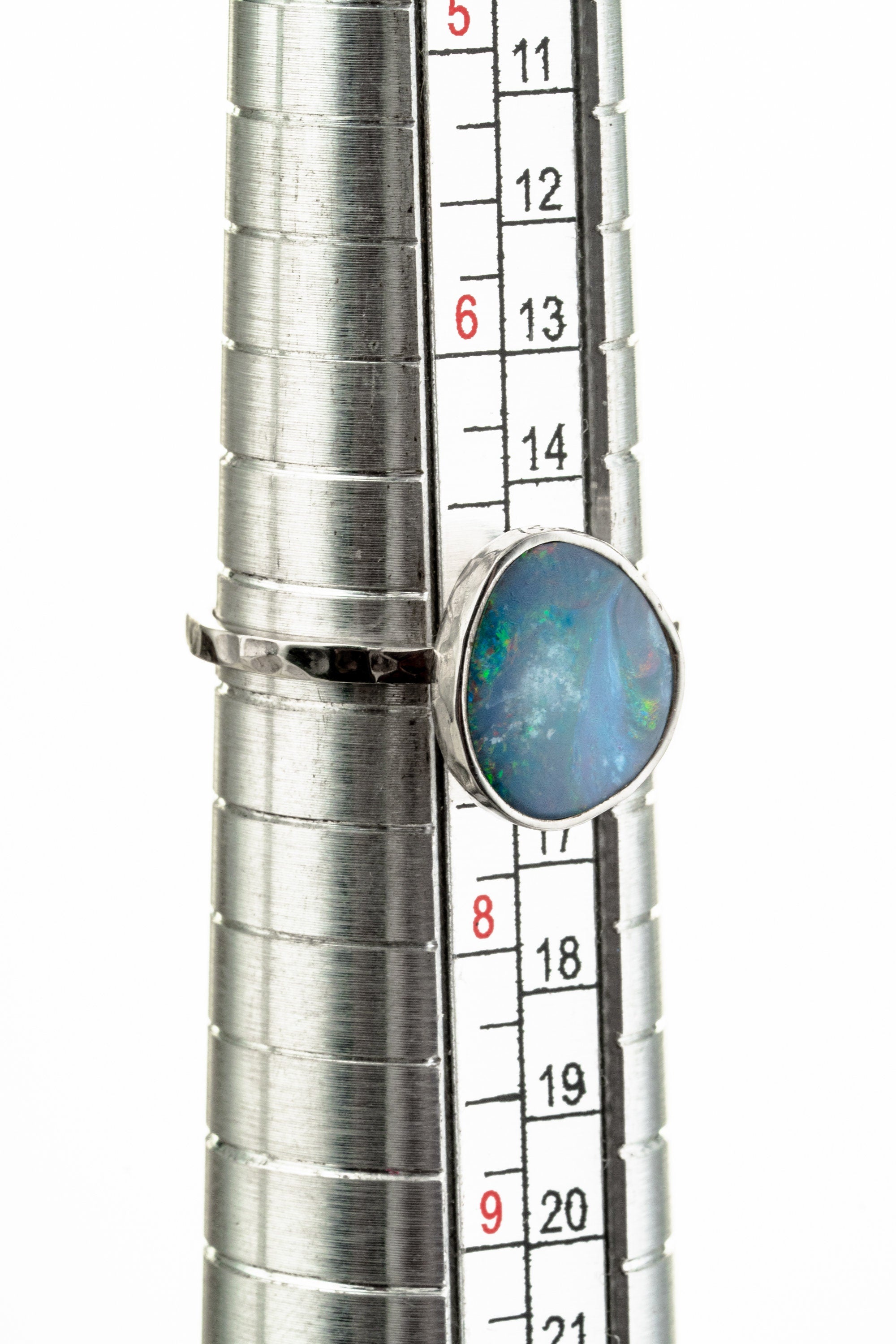 Precious Australian Opal Doublet Ring shown beside a ruler for scale with textured 925 silver band and Opal focal stone.