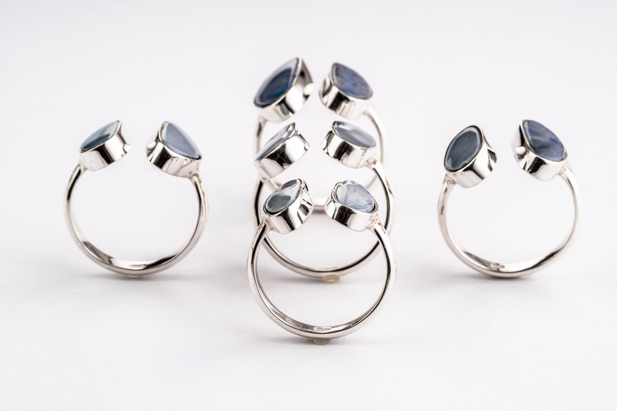 Australian Opal Doublet Adjustable Rings shown on white background with blue and violet opal colour play.