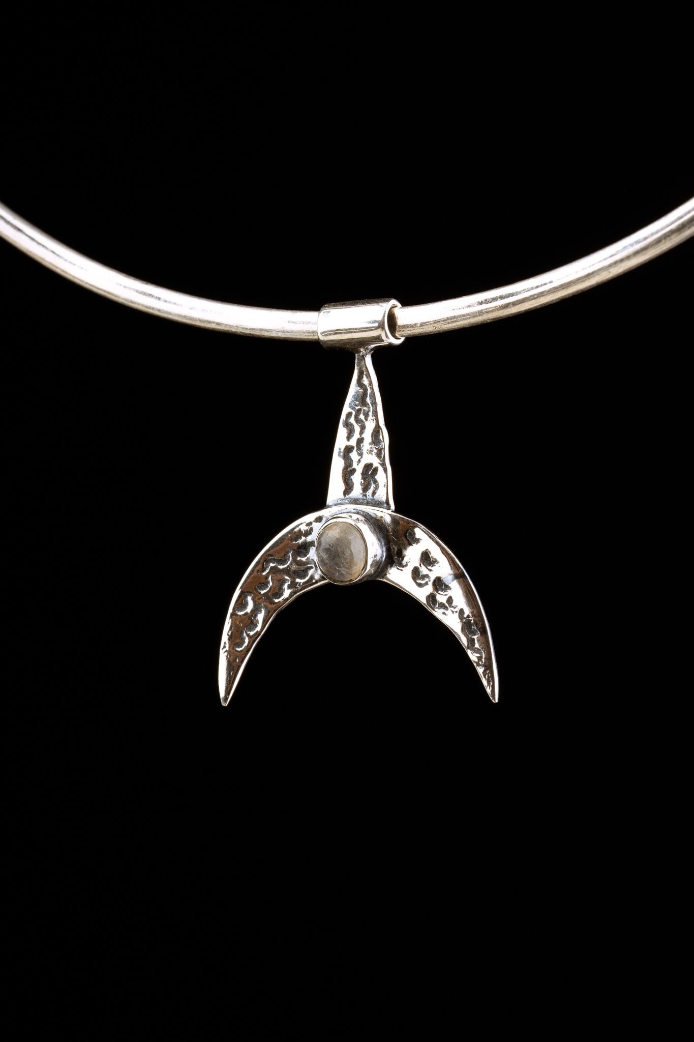 Blue Moonstone crescent whale pendant displayed on a choker with textured oxidized sterling silver finish.