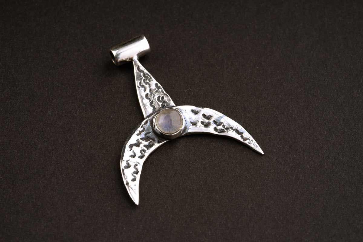 Moon Whale Blue Moonstone pendant shown on dark background with oxidized sterling silver crescent shape.