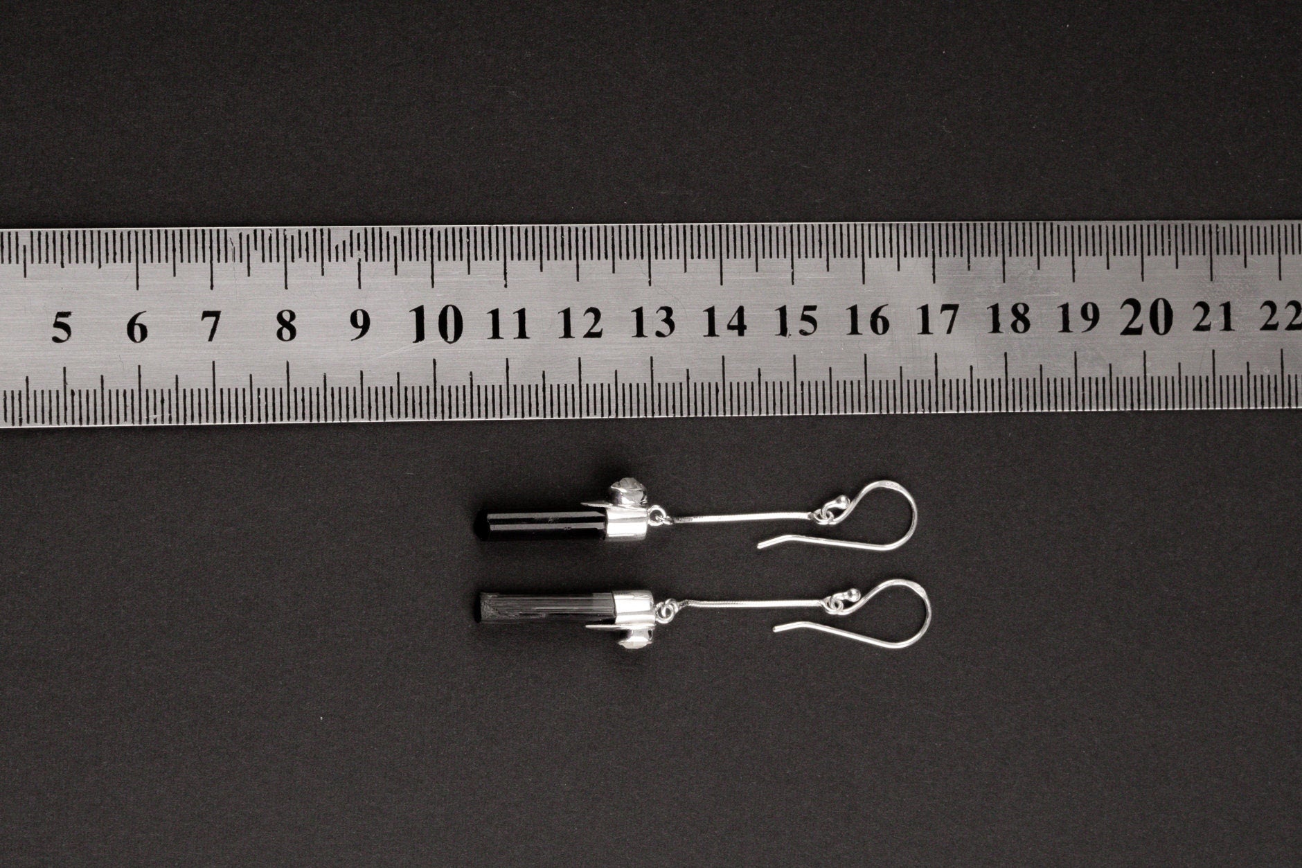 Tourmaline Herkimer Diamond long dangle earrings shown beside a ruler for scale, approximately 5 cm tall.