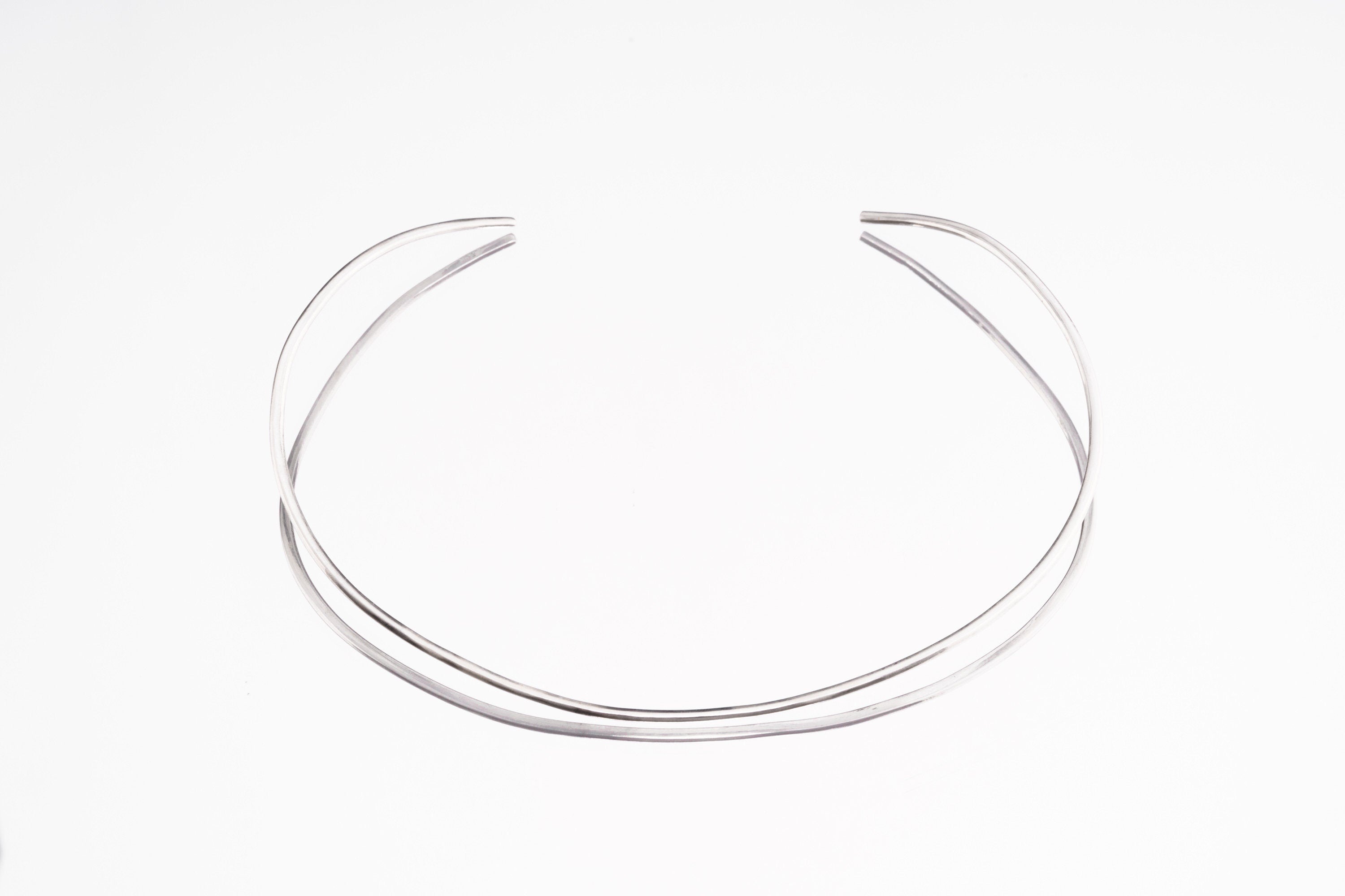 Sterling silver open collar choker shown in high-shine silver finish as an alternate minimal necklace option.