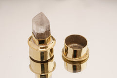 Rutilated Quartz gold-plated brass capsule pendant shown open with stone-topped lid and hidden storage space.