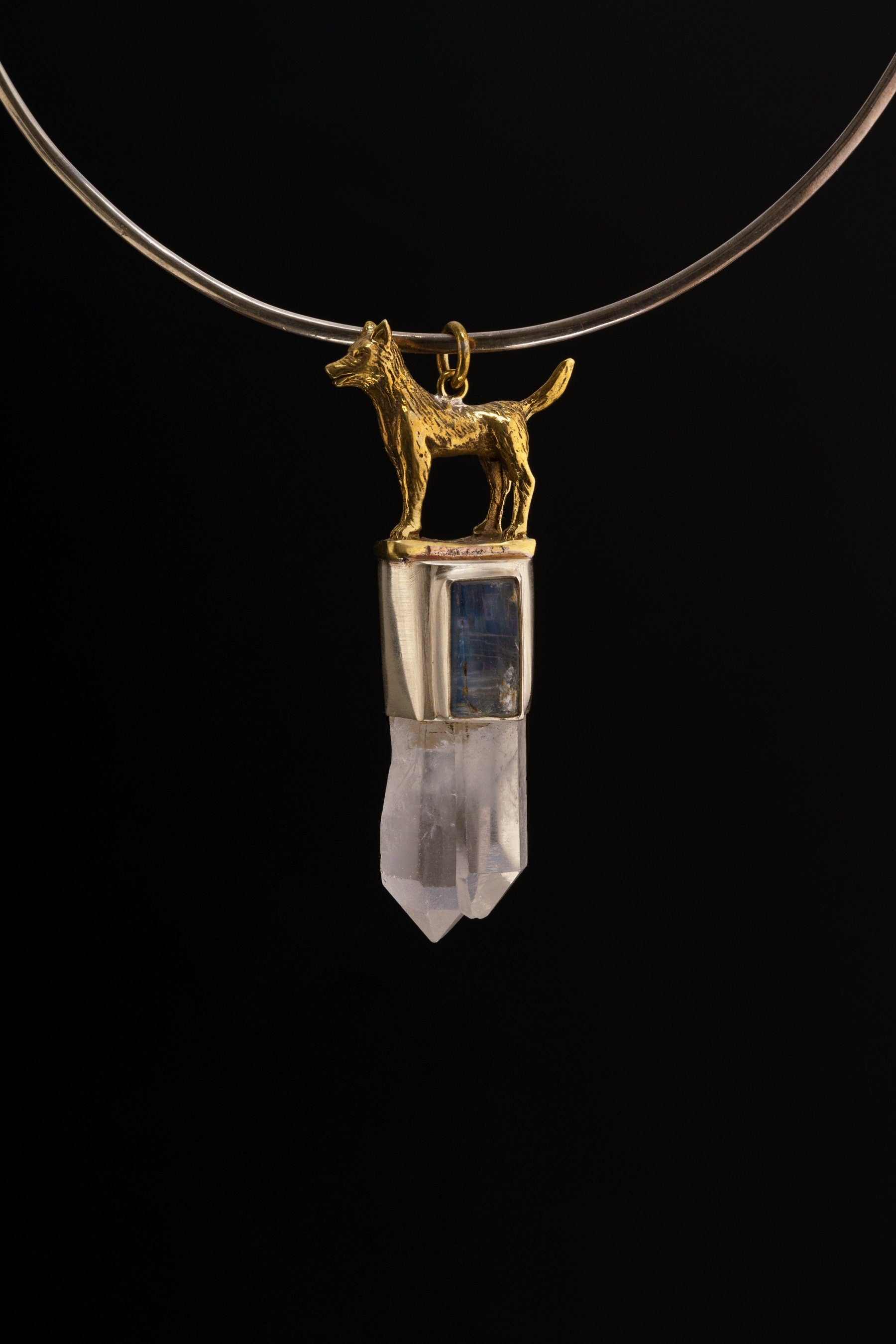 Dog Clear Quartz Kyanite pendant shown on a black necklace with handmade sterling silver animal talisman detail.