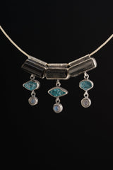 Grounding Vision Stack Pendant with Black Tourmaline, Blue Apatite, and Labradorite in oxidized sterling silver, shown on black cord.