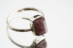 Pink Tourmaline sterling silver ring shown on a light background, with smoky rose gemstone and handmade silver setting.