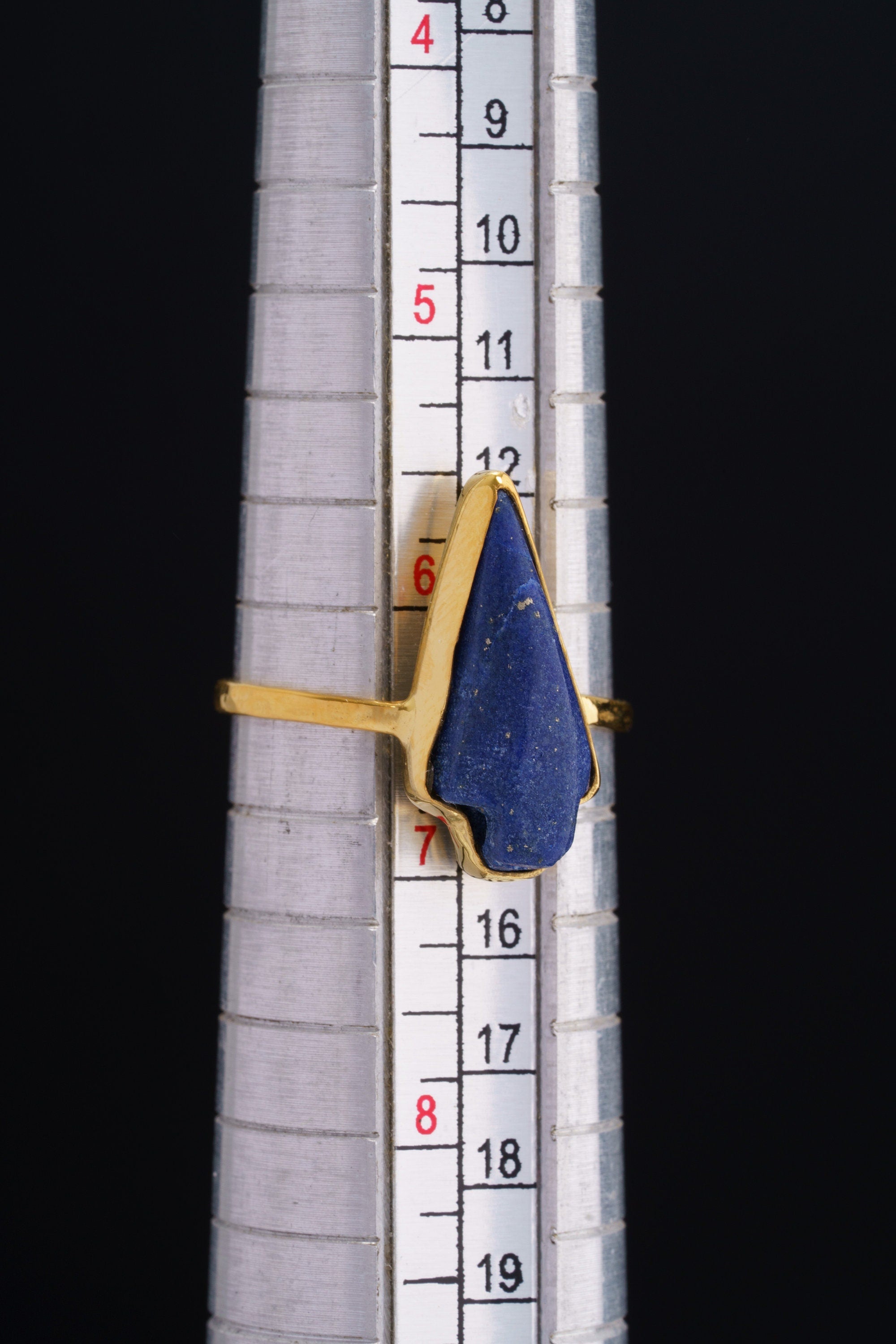 Lapis Lazuli Gold Plated Silver Ring shown beside a ruler for scale with blue stone and gold plated silver band.