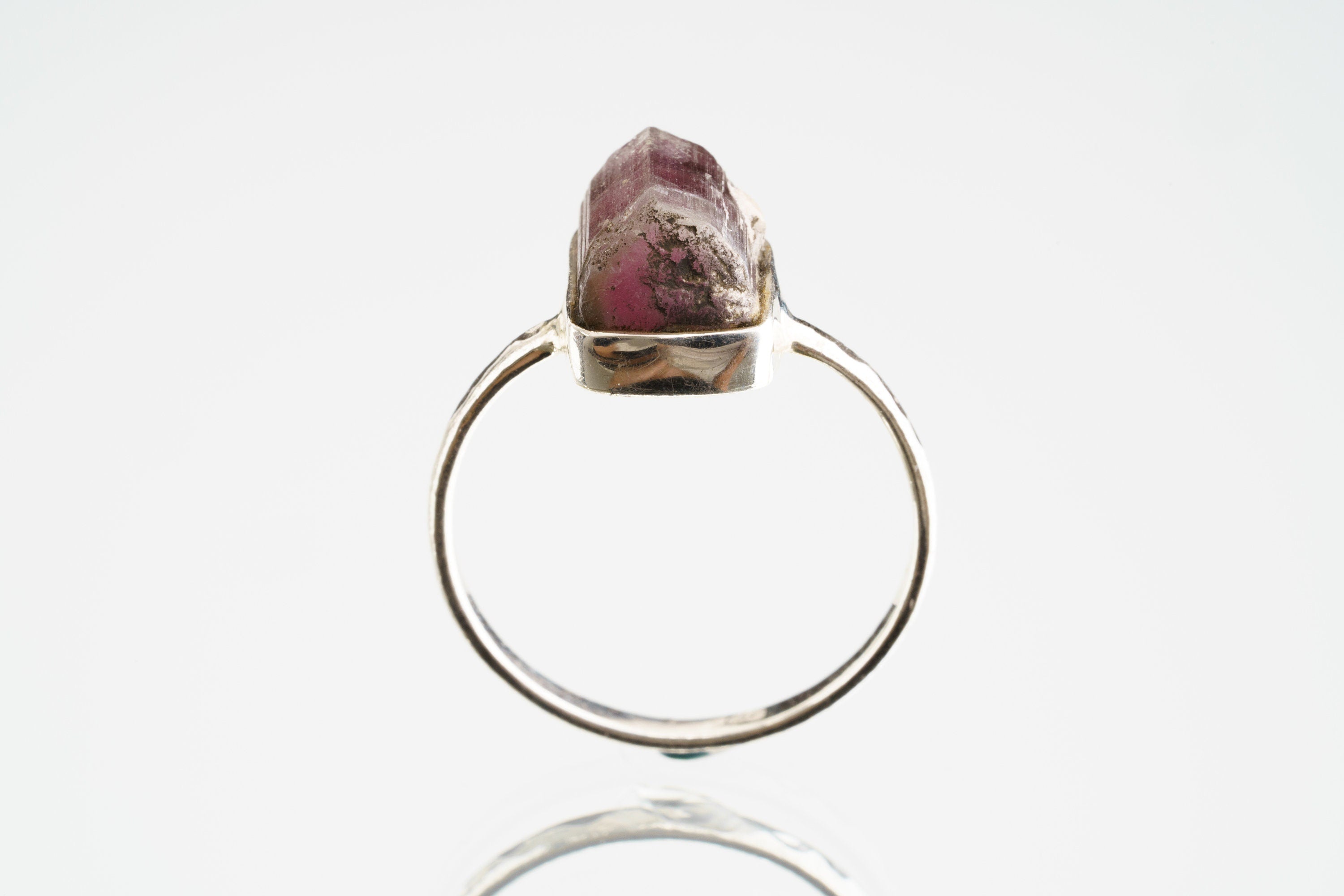 Front view of handmade Pink Tourmaline ring showing deep rose mineral colour, secure silver setting, and polished band.