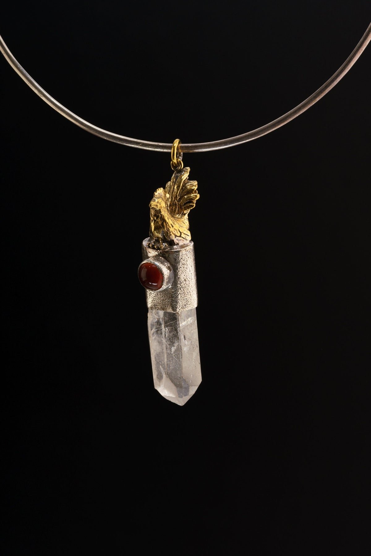 Rooster Carnelian Clear Quartz talisman pendant shown on a black necklace, with symbolic metalwork and clear crystal point.