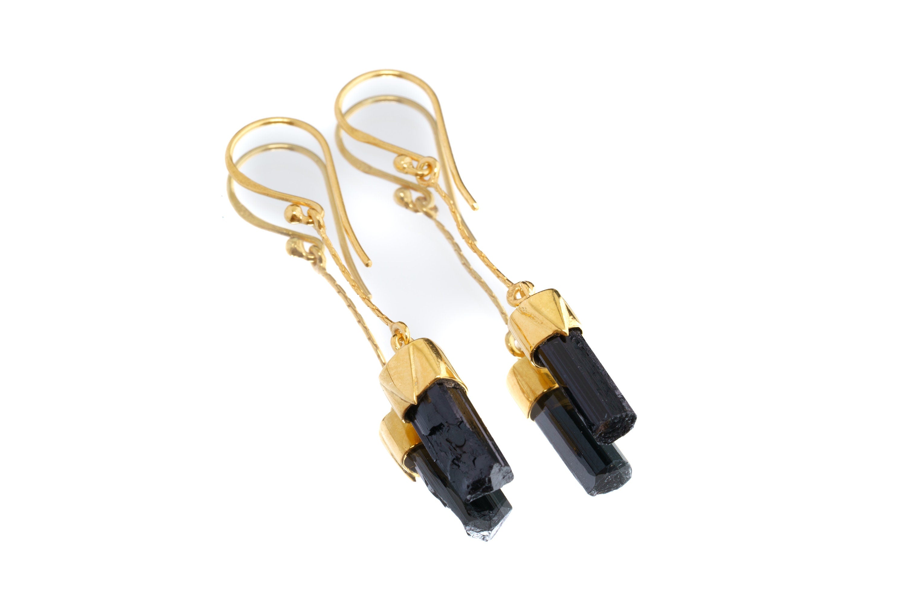 Black Tourmaline earrings shown on a white background with gold-plated sterling silver hooks and raw black crystal dangles.