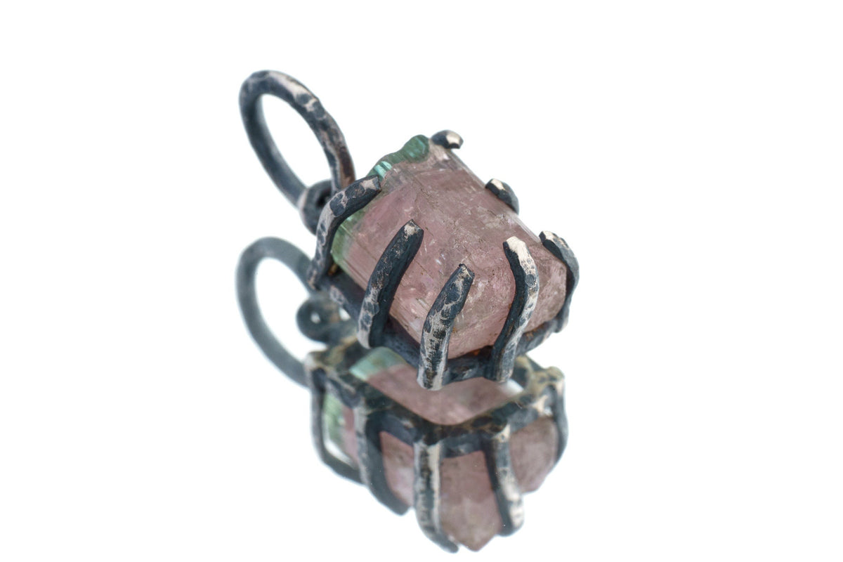 Watermelon Tourmaline Claw Pendant on white background with oxidized sterling silver and natural pink-green crystal.