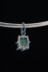 Watermelon Tourmaline pendant shown beside ruler for scale with pink-green crystal in oxidized silver claw setting.