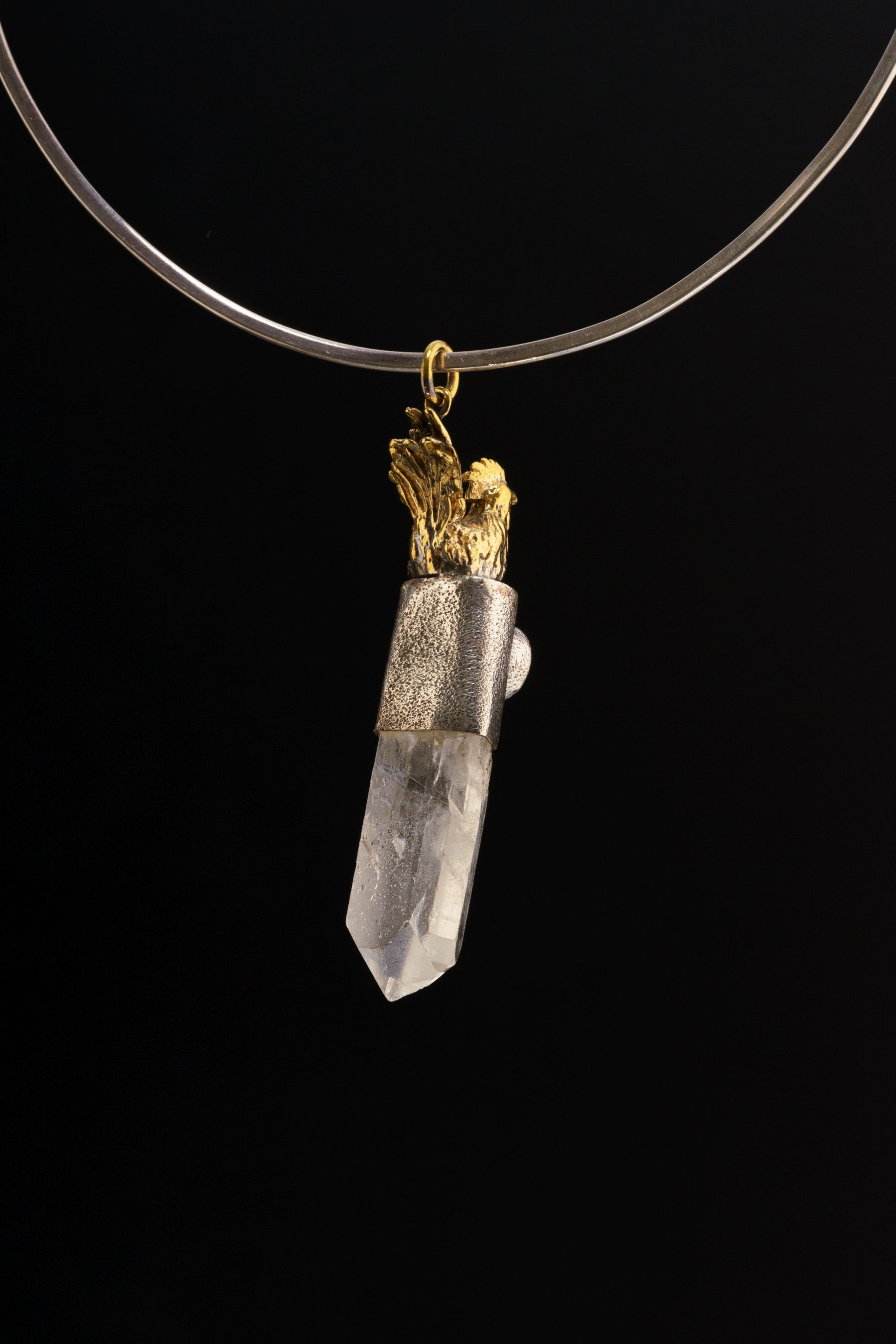 Rooster Carnelian Clear Quartz pendant shown worn on a black necklace as a courage and dawn protection charm.