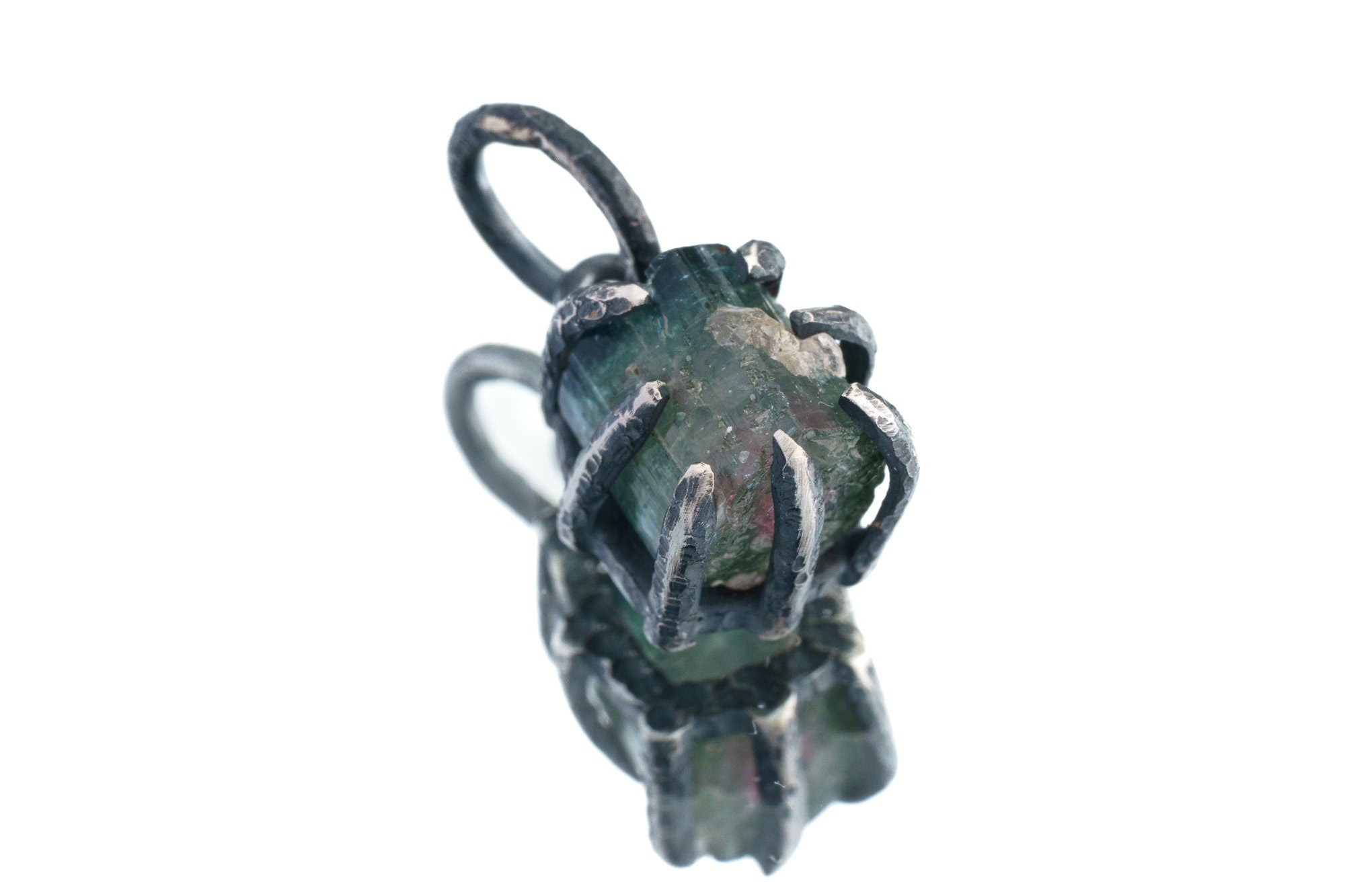 Watermelon Tourmaline pendant on white background showing handmade oxidized silver claw frame and raw crystal detail.