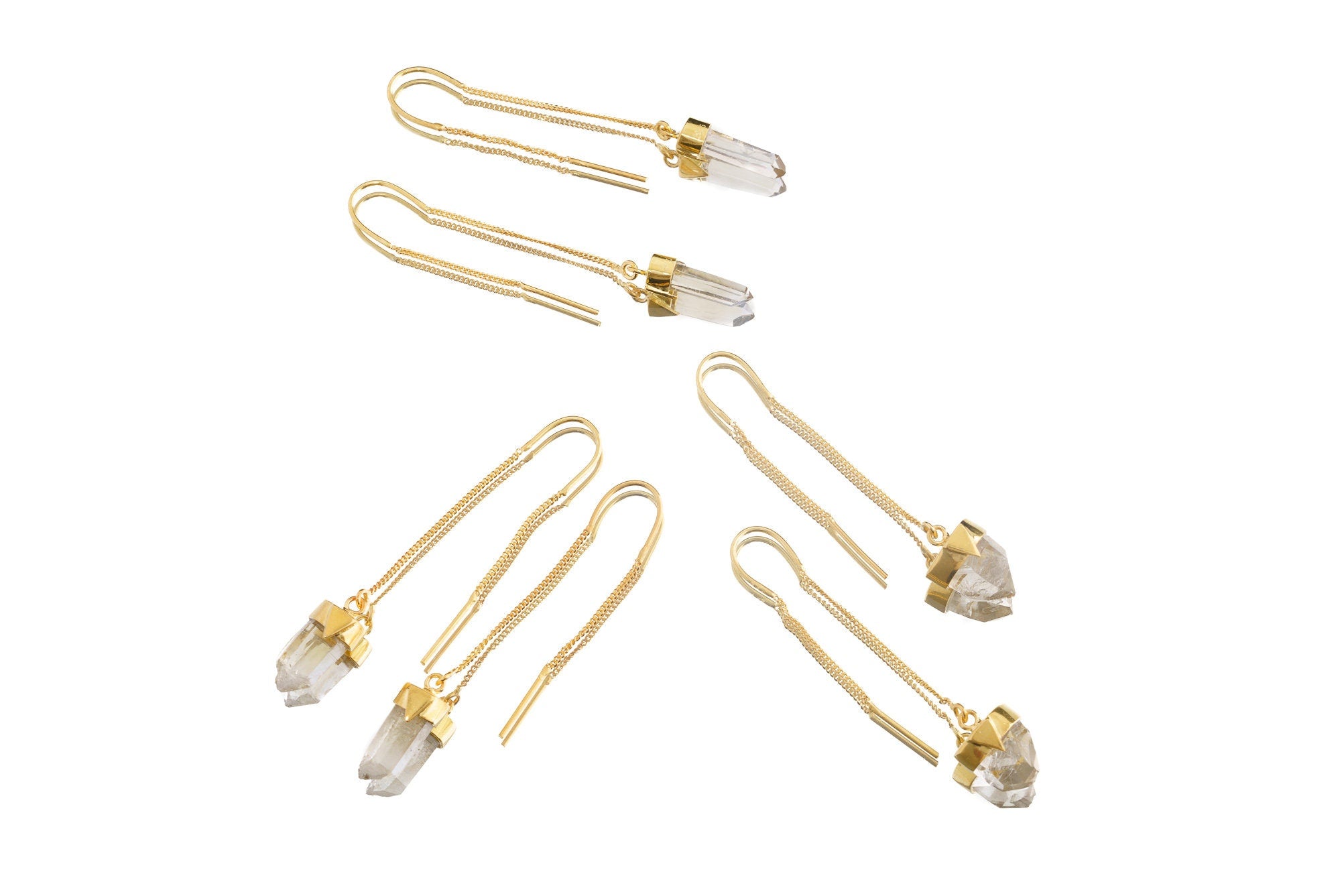 Himalayan Quartz gold-plated single dangle earrings displayed as a collection on white background.