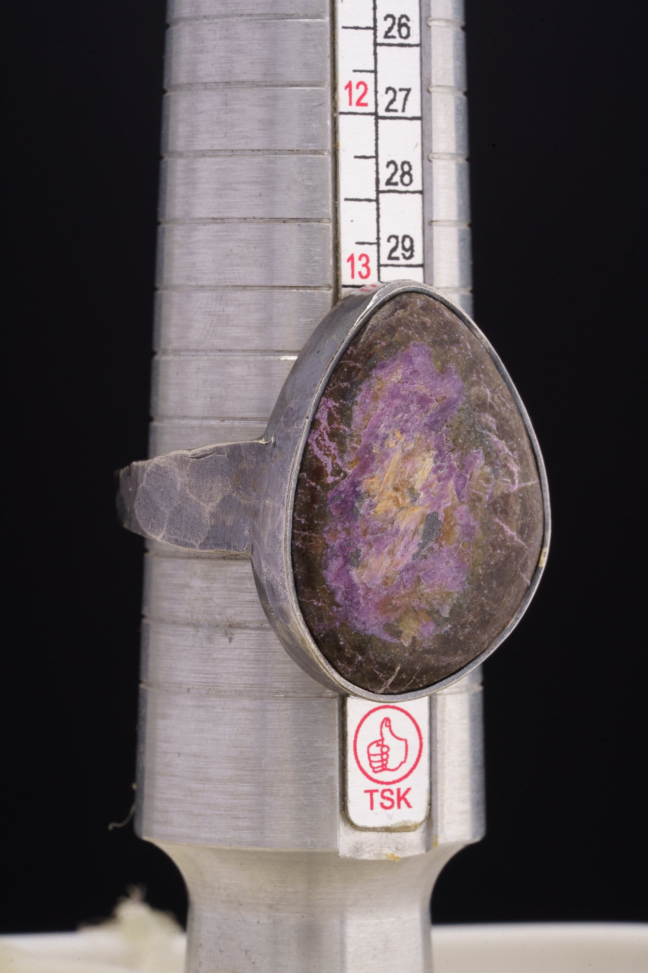Sugilite oxidized silver ring shown beside a ruler for scale, with rugged 925 sterling silver construction.