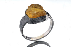 Front view of Citrine oxidized silver ring showing golden yellow quartz and strong hammered sterling silver profile.