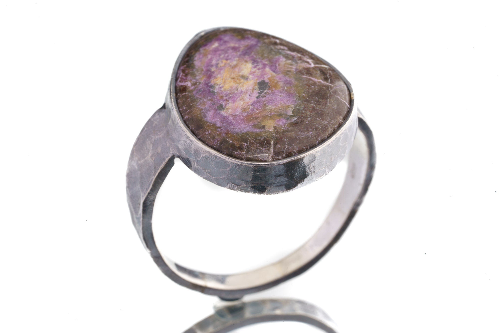Side view of Sugilite ring showing oxidized sterling silver texture, raised bezel setting, and strong ring profile.