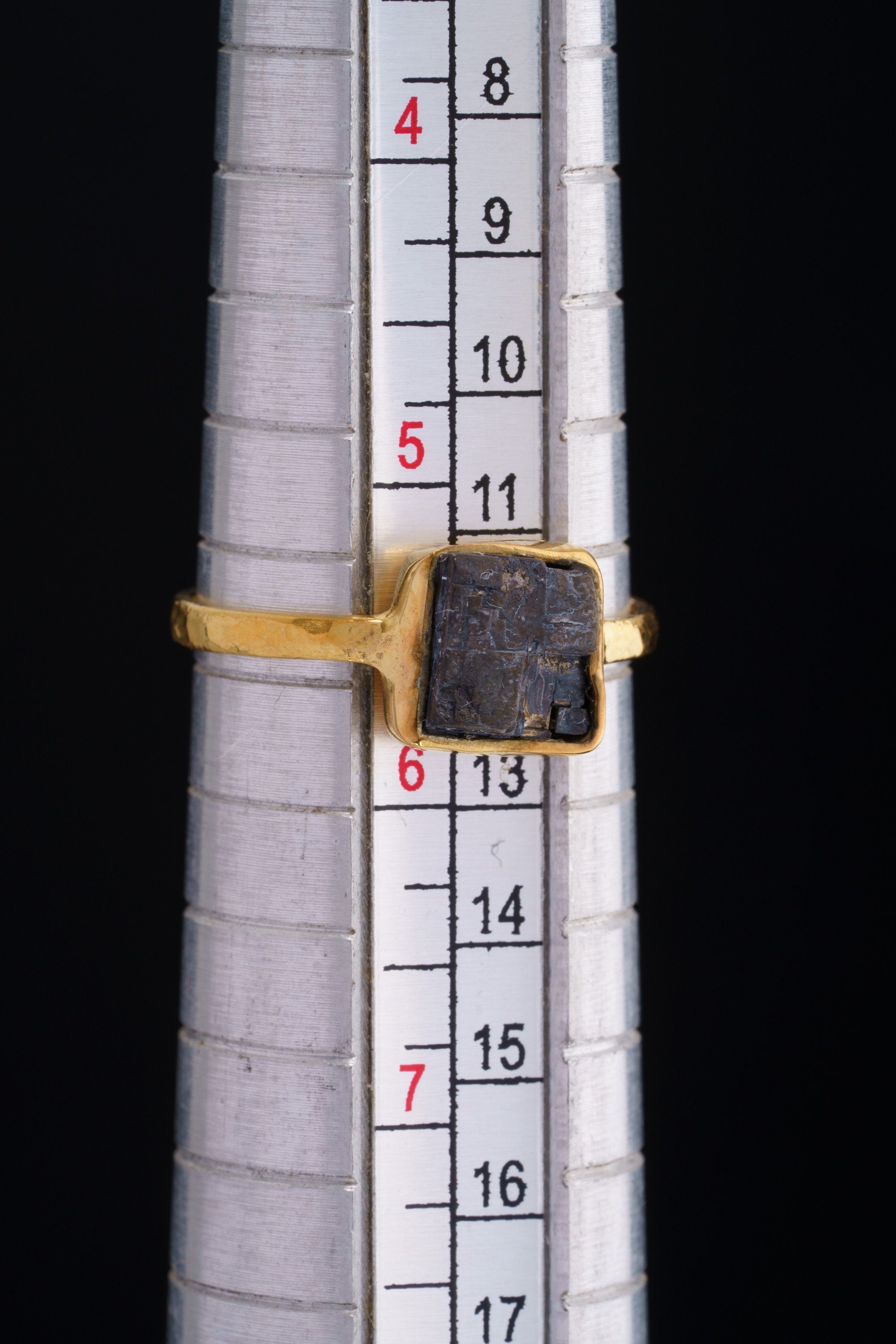 Gold-plated Pyrite ring shown on a mandrel for size reference, appearing around US size 5.5 to 6.