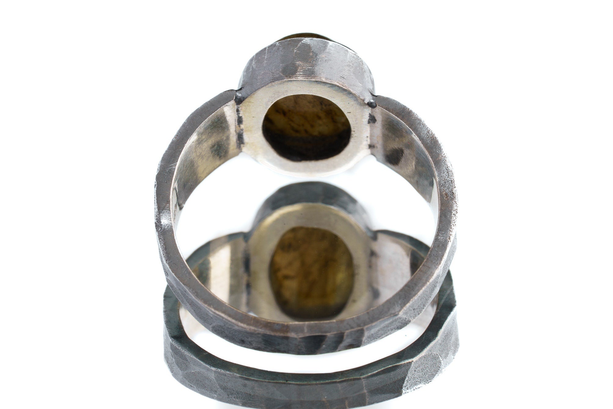 Back view of Mystic Oculus Labradorite ring showing U-shaped band, oxidized texture, and sculptural silver construction.