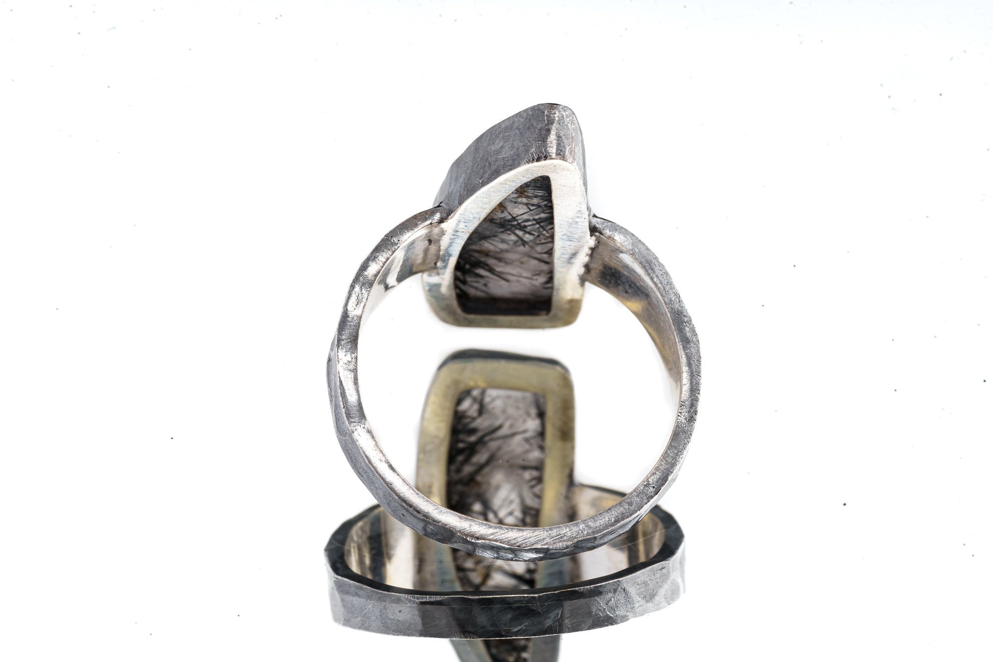 Back view of Rutilated Quartz ring showing open-back bezel construction and hammered oxidized silver band.
