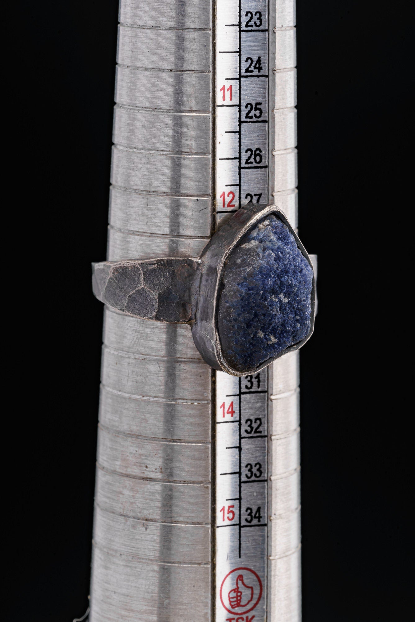 Dumortierite oxidized silver ring shown beside a ruler for scale, with rugged 925 sterling silver construction.