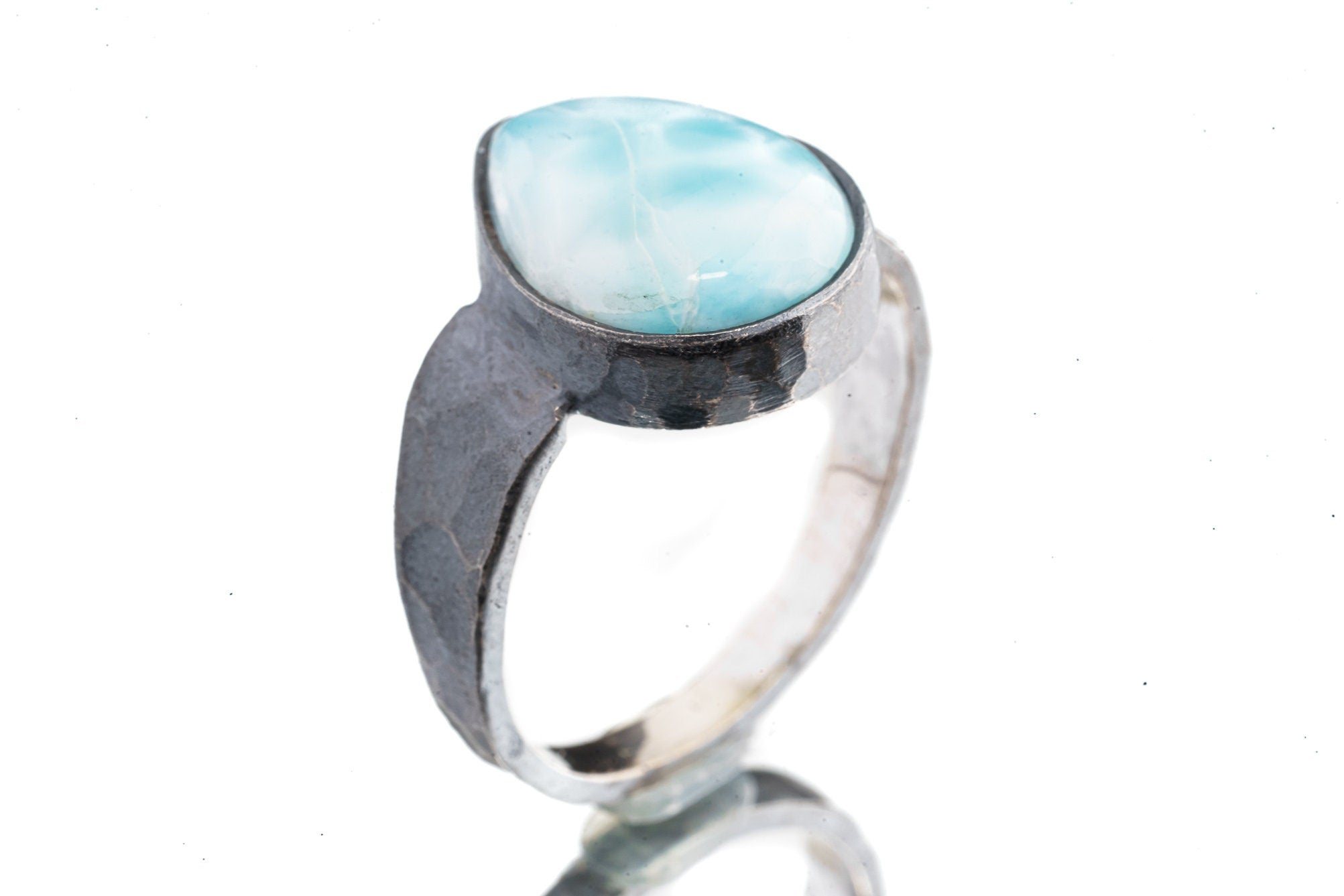 Side view of Larimar oxidized silver ring showing rugged hammered band texture and strong masculine profile.
