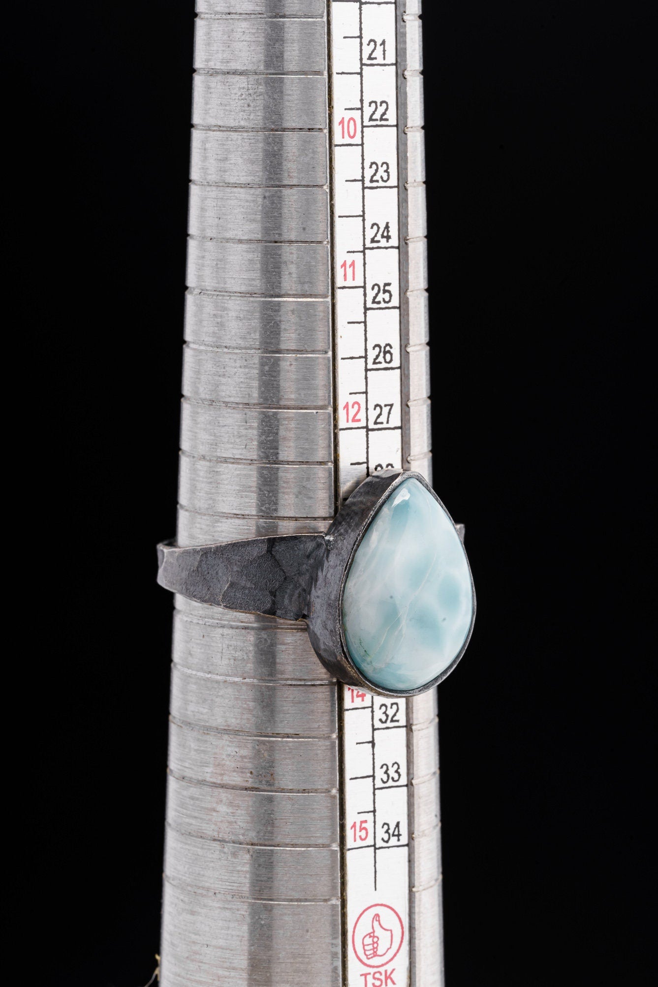 Larimar oxidized silver ring shown beside a ruler for scale, with rugged 925 sterling silver construction.