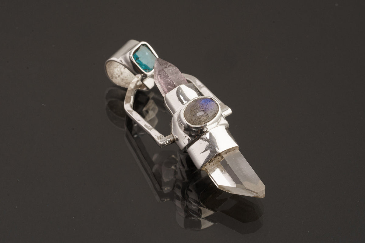 Two Sided Crystal Spinner Pendant shown on black background with high-polish sterling silver and mixed gemstone construction.