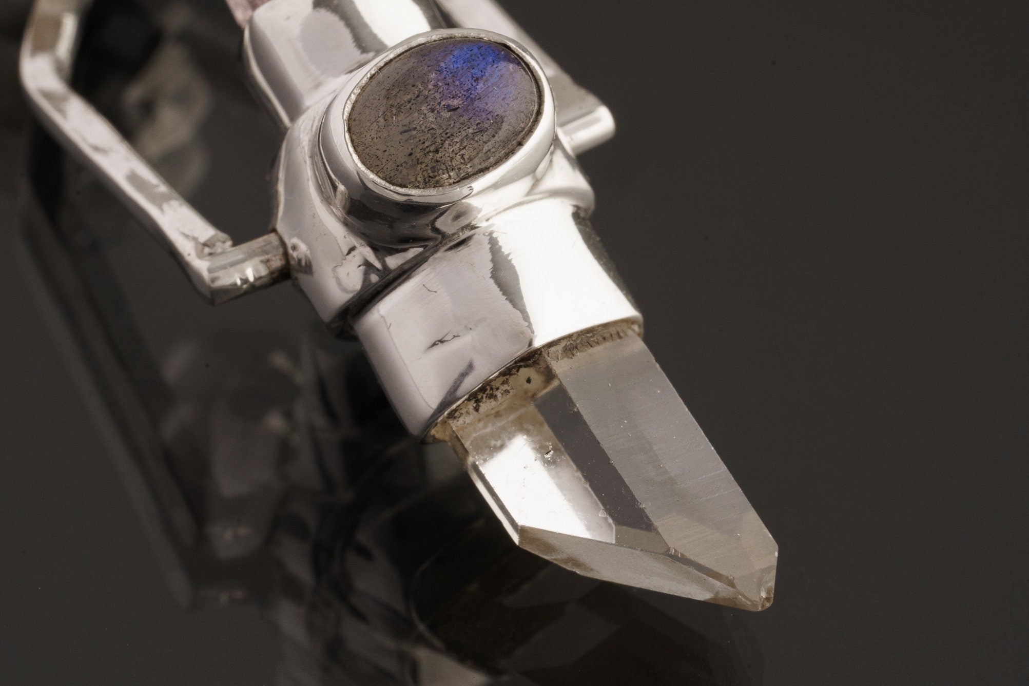 Two Sided Crystal Spinner Pendant shown on black background with Himalayan Clear Quartz, Amethyst, and sterling silver spinner setting.