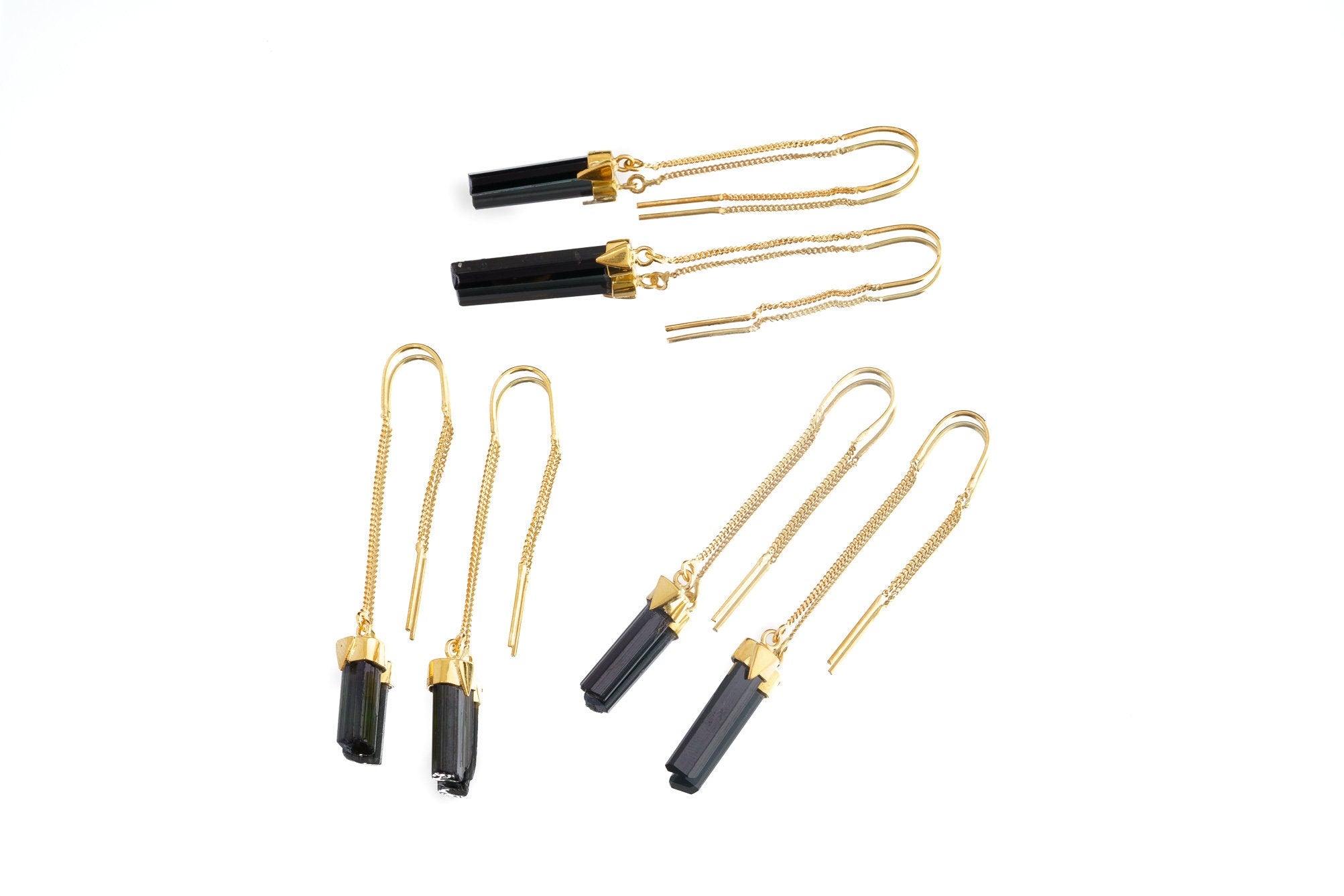 Collection of handmade gold-plated Tourmaline dangle earrings shown on white background with dark crystal drops.