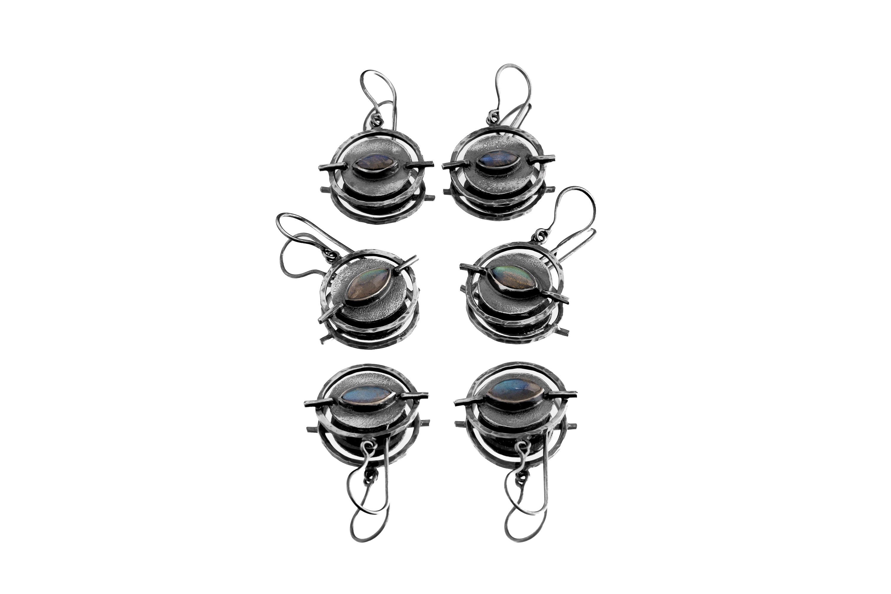 Collection of handmade Labradorite Circle earrings showing natural stone variation and textured sterling silver.