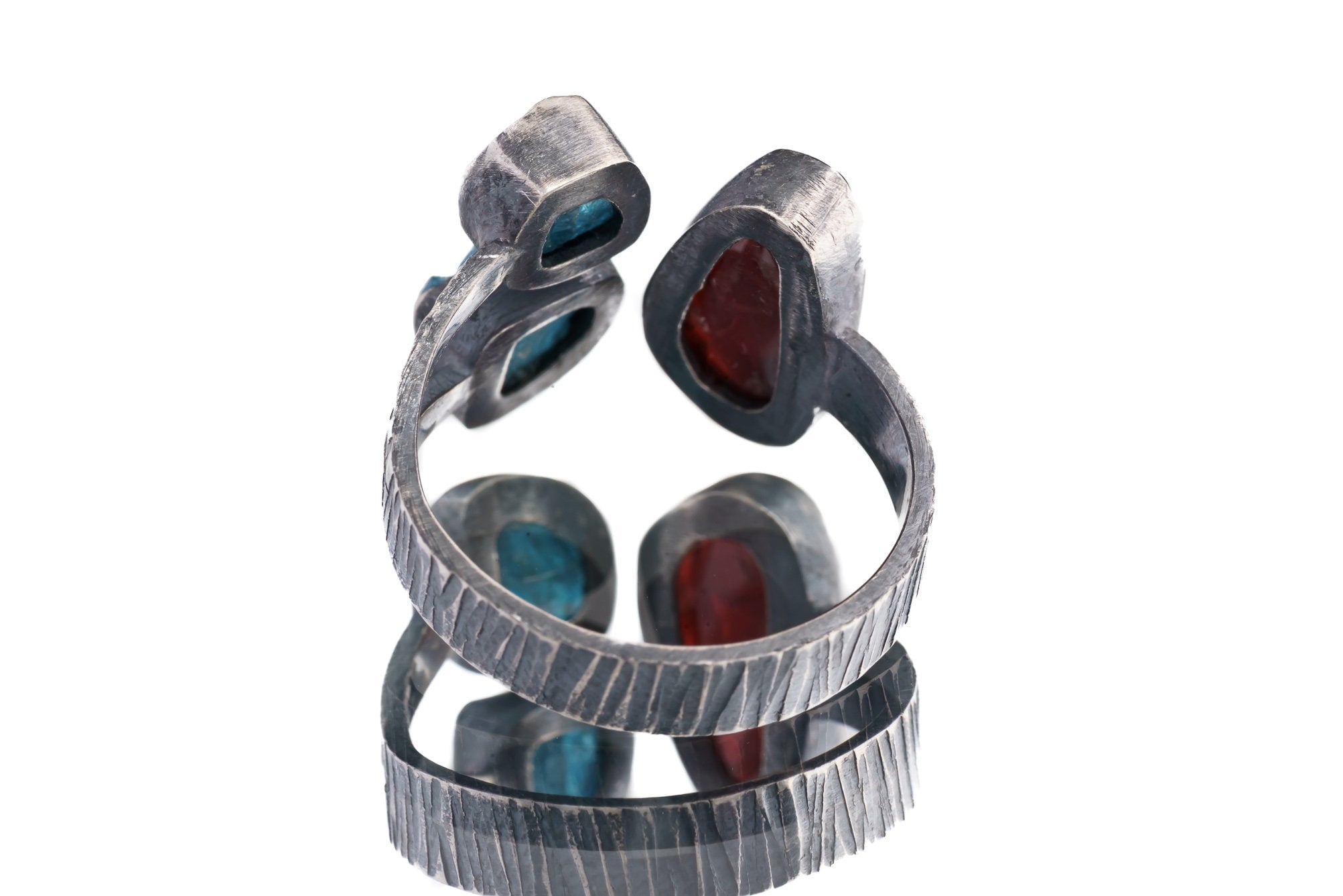 Back view of adjustable Apatite Ammolite Ammonite ring showing open sterling silver band and multi-stone construction.