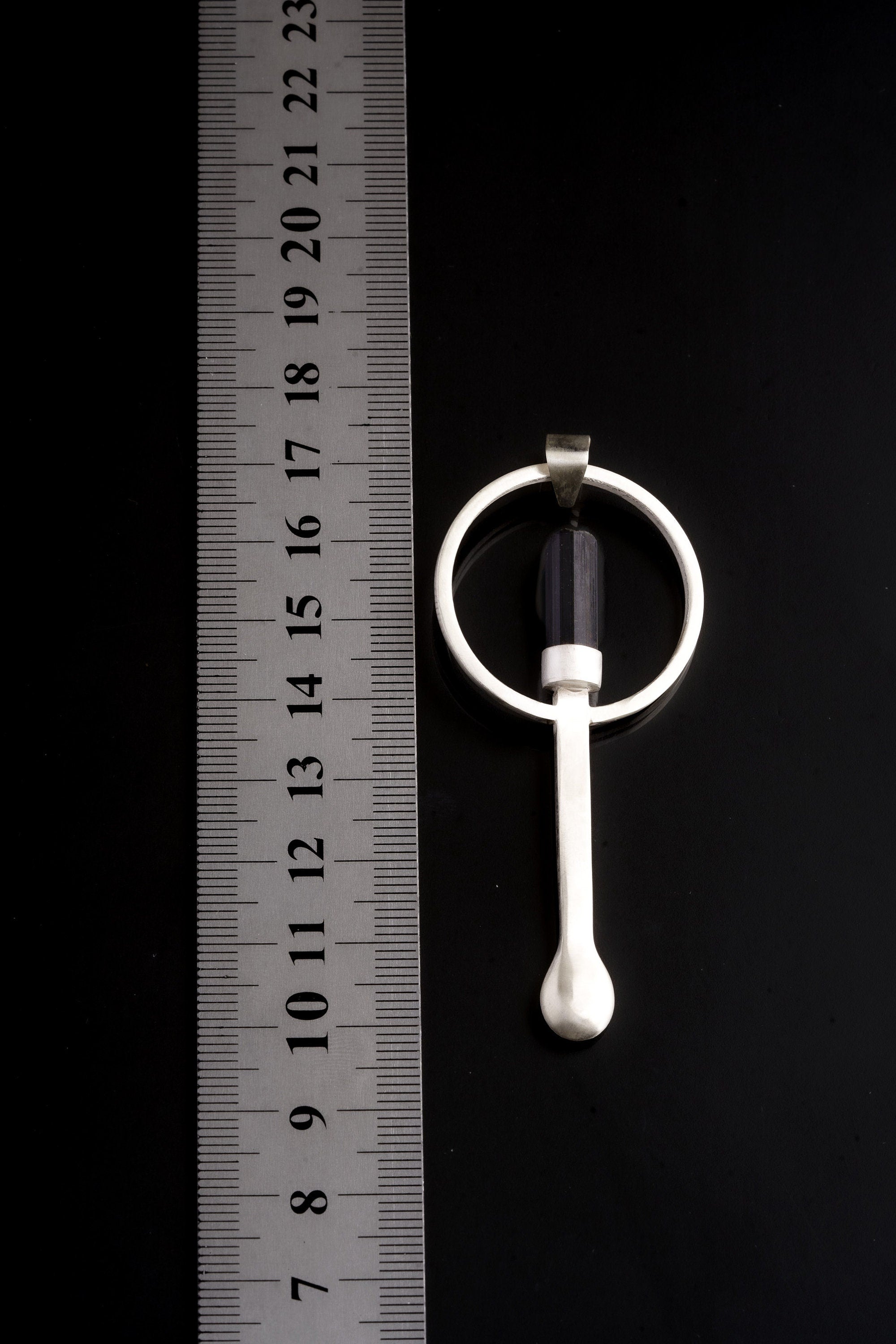 Black Tourmaline sterling silver ritual spoon shown beside a ruler for scale with solid cast silver body.