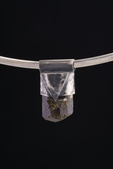 Himalayan Dravite Tourmaline Stack Pendant shown on black background with oxidized sterling silver cap and dark terminated crystal.