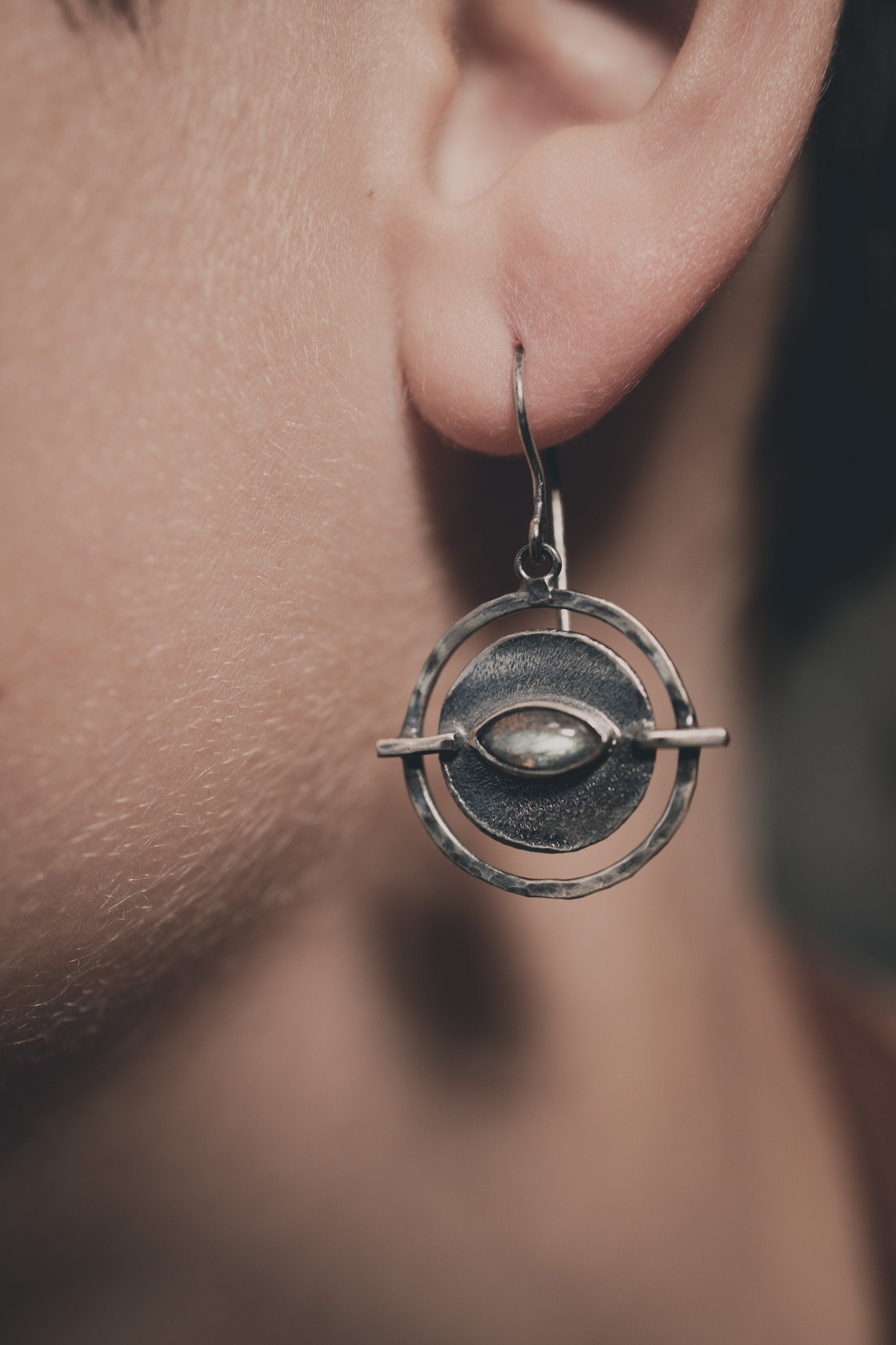 Old World Labradorite Circle earring shown worn on a model, highlighting the portal-style silver frame.