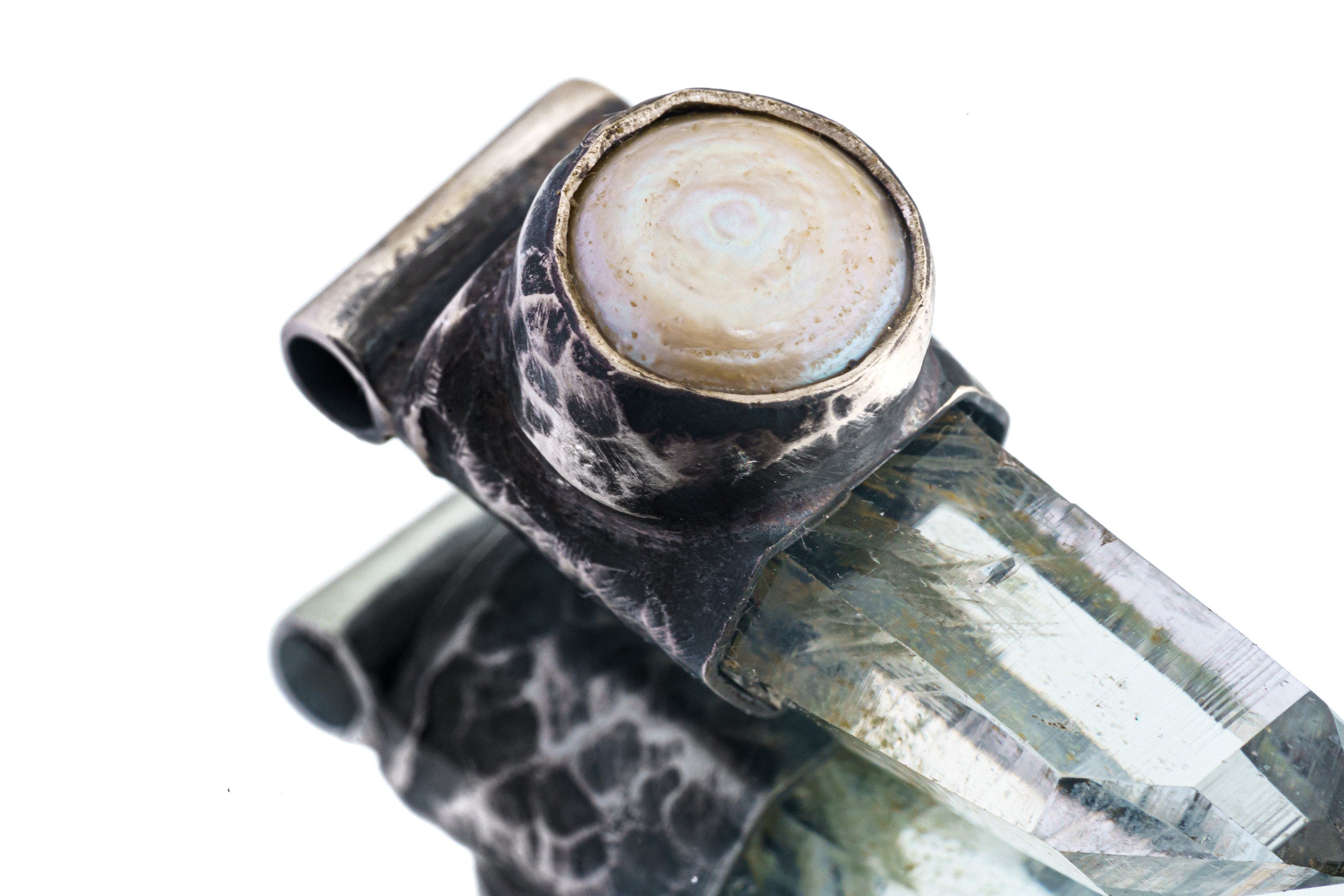 Close-up of old South Sea Pearl set above Nepal Inclusion Quartz in an oxidized sterling silver Stack Pendant cap.