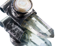 Close-up of Nepal Inclusion Quartz in an oxidized sterling silver Stack Pendant cap.